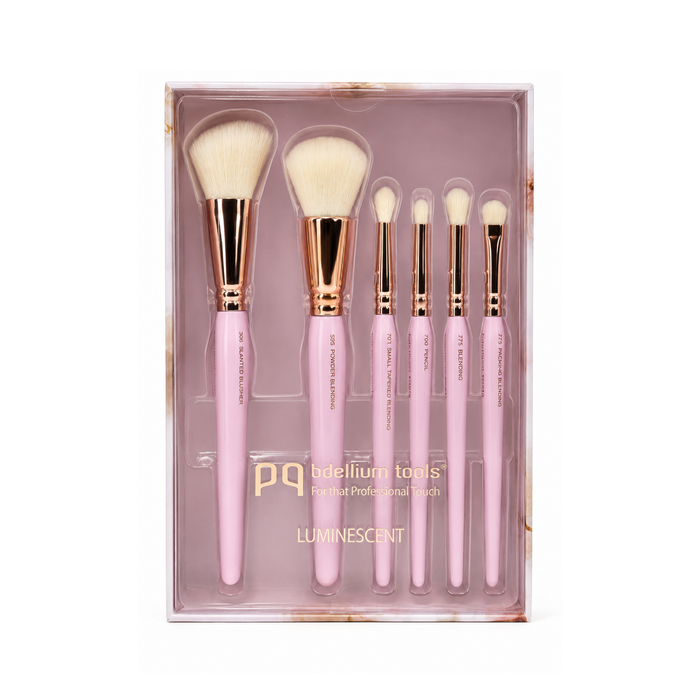 Set completo de 15 brochas Luminescent de Bdellium Tools, destacando el acabado iridiscente de los mangos y las virolas en oro rosa.