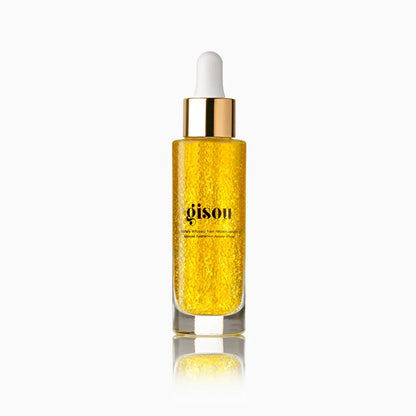Frasco de vidrio del suero capilar Honey Infused Hair Repair Serum con microcápsulas visibles.