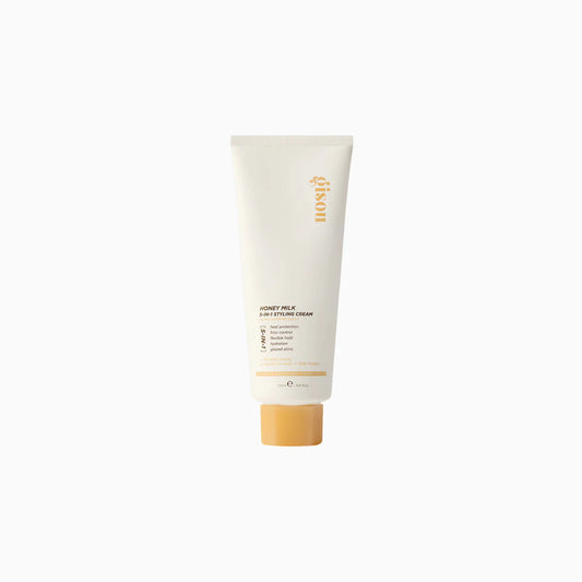 Tubo de crema para peinar Honey Milk 5-in-1 Styling Cream con diseño minimalista.