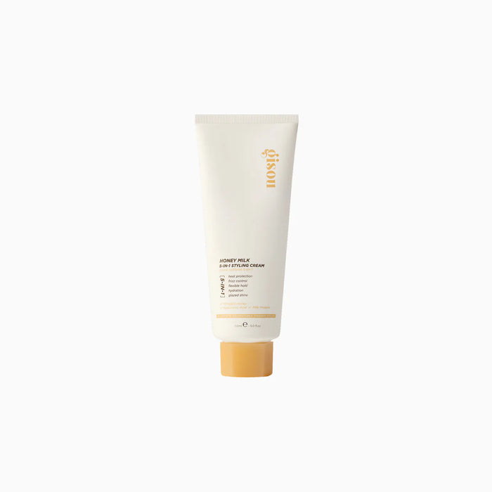 Tubo de crema para peinar Honey Milk 5-in-1 Styling Cream con diseño minimalista.