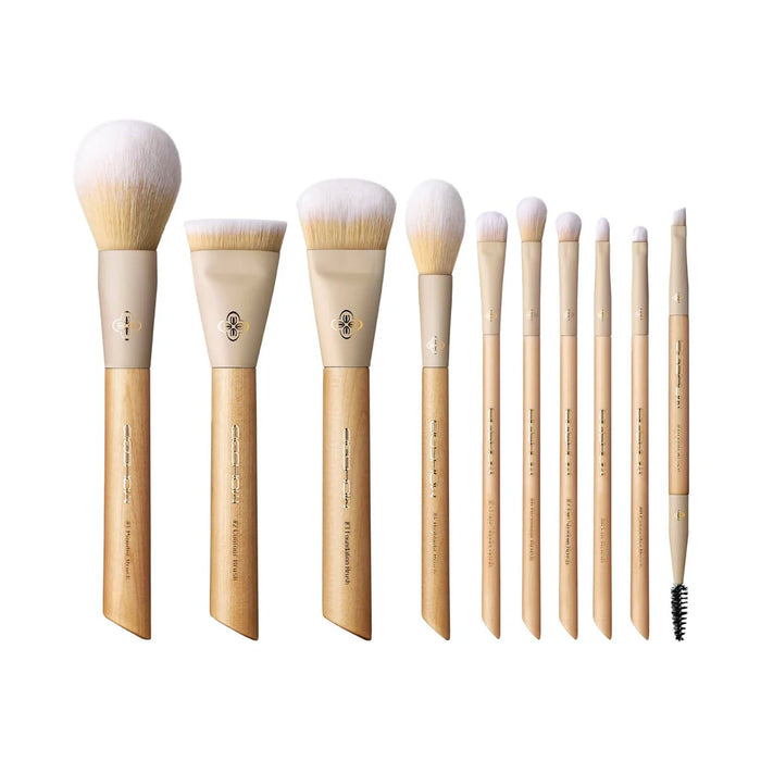 Set profesional de 10 brochas de maquillaje EIGSHOW Origin Series con mangos de madera natural y bolso clutch.